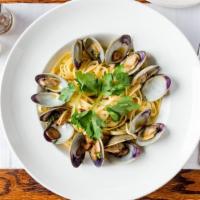 Linguine Con  Vongole · Covered with clams in a white or red sauce.