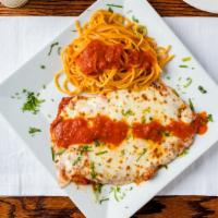Chicken Parmigiana · Breaded chicken filet, topped with tomato sauce and mozzarella cheese.