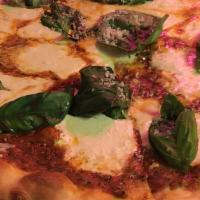 Pink Pizza · Fresh mozzarella, vodka sauce, fresh garlic, parmesan and fresh basil.