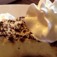 Tiramisu · Alternating layers of coffee liquor soaked sponge cake and mascarpone cheese sprinkled with ...