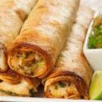 Flautas · Flautas with chicken, steak, or cheese topped with sour cream lettuce cotija cheese and tomato