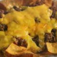 Nachos Con Carne Al Gasto · Choice of meat topped with refried beans, melted cheese, cream and jalapenos