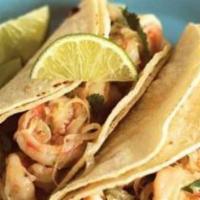 Tacos Con Camaron · 2 shrimp tacos topped with onion, cilantro, lettuce, tomato, sour cream and cheese.