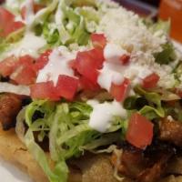 Taco Salad With Chicken · With lettuce, tomato, beans, cream, cheese, salsa, onions, cilantro and guacamole in a torti...