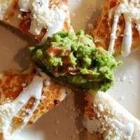 Quesadillas Lunch · Quesadillas topped with sour cream and cheese. Served with black beans and Mexican rice,