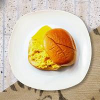 Classic Vegan Breakfast Sandwich · JUST egg, hash brown, ketchup, and Follow Your Heart Cheese served on a bread.