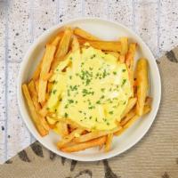 Cheese Fries · Idaho potato fries cooked until golden brown & topped with melted Follow Your Heart cheese.
