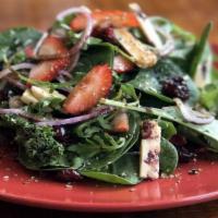 Insalata Di Mariangela · Mixed greens with goat cheese, fresh strawberries and red onions.