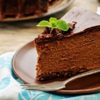 Chocolate Cheesecake · Rich and creamy chocolate cheesecake baked inside a honey-graham crust.