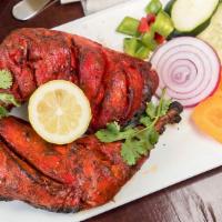  Tandoori Chicken (Full) · Chicken marinated in yogurt & mild spices cooked in clay oven