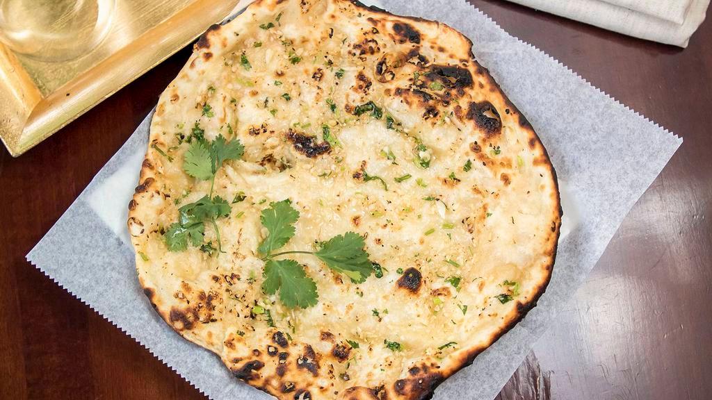 Garlic Naan · Son unite bread with fresh garlic & coriander baked in clay oven