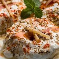 Dahi Wada · Lentil balls served in yogurt and topped with tamarind chutney. Served with mint and onion c...