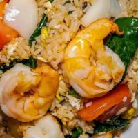 Classic Thai Fried Rice · Served with jasmine rice. Wok sautéed rice with egg, onion, tomato and Chinese broccoli.