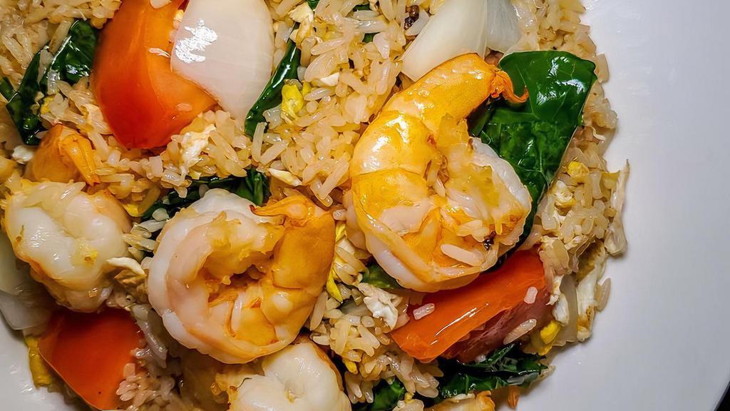 Classic Thai Fried Rice · Served with jasmine rice. Wok sautéed rice with egg, onion, tomato and Chinese broccoli.