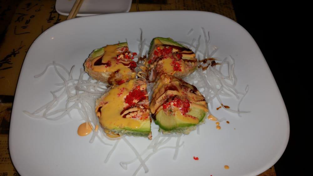 Dinosaur Egg · Deep fried avocado, wrapped with spicy kani, spicy tuna inside in chef's sauce.