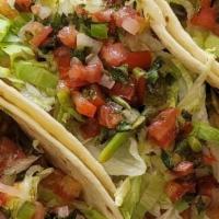 Tacos (4) · Order comes with 4 tacos. Your choice of meat and style. Street (corn tortilla with onions &...