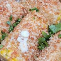 Takis Mexican Street Corn · Adding some fuego to the original, this corn is crusted with mayo and a cotija cheese and cr...