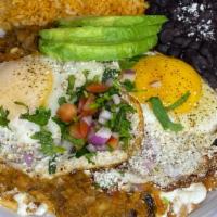 Huevos Rancheros · 2 deep fried tortillas with 2 fried eggs on a homemade tomato/habanero salsa. Topped with pi...