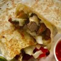 Lamb Wrap · Our wrap or burrito filled with our tasty grilled lamb, sauteed onions and green peppers, sa...