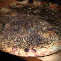 Zaatar Bread · Pita topped with olive oil, sesame and thyme. Served with lemon juice and olive oil mixed in...
