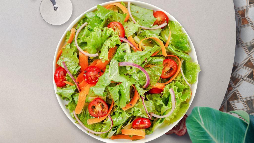 Mixed Greens Salad · (Vegetarian) Romaine lettuce, cherry tomatoes, carrots, and onions dressed tossed with lemon juice & olive oil