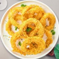 Onion Rings · Sliced onions fried until golden brown and garnished with sea salt and spices.