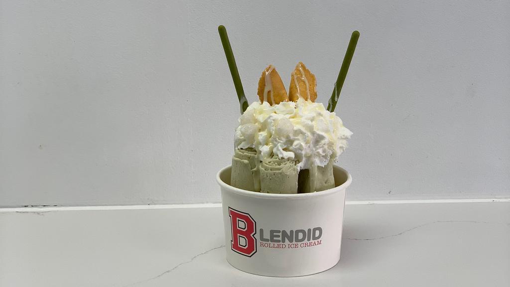 Match Matcha · Matcha flavored Ice Cream topped with whipped
cream, condensed milk, mochi, matcha pocky, and a fortune cookie.