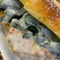 Grilled Chicken & Broccoli Rabe Hero · Served on seeded hero. Grilled chicken, garlic, broccoli rabe, and cheese.