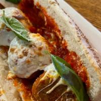 Meatball Parmesan Hero · Served on seeded hero. Meatballs made of pork and beef, sausage, and fresh mozzarella.