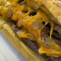The Philly Hero · Served on seeded hero. Chopped steak and caramelized onion and cheese.