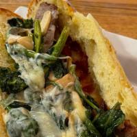 Sausage & Broccoli Rabe Hero · Served on seeded hero. Sweet Italian sausage, broccoli rabe, and cherry peppers served with ...
