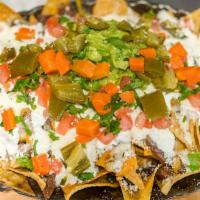 Regular Nachos (No Meat) · Served with beans, mixed cheese, sour cream, guacamole, tomatoes, cilantro, powder cheese an...
