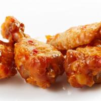 The Nuclear Wings · A very spicy sauce smothered over oven-baked crispy chicken wings.