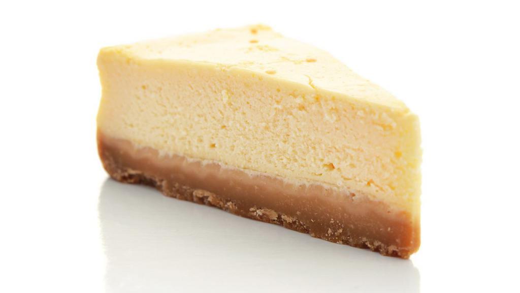 Ny Cheesecake · A slice of NY cheesecake made with a fresh crust filled with cream cheese.