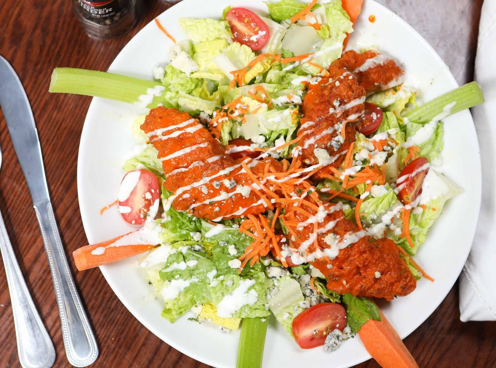 Buffalo Chicken · buffalo tenders, romaine, blue cheese crumbles, tomatoes, ranch, celery, carrots, blue cheese dressing.
