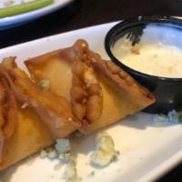 Buffalo Chicken Wontons · Wonton wraps with chicken, cheese, and buffalo sauce, served blue cheese dressing.