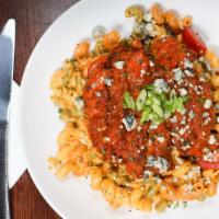 Buffalo Mac ‘N' Cheese · Cavatappi pasta Tossed with a creamy cheddar sauce, topped with mild chicken tenders and blu...