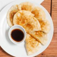 Pan Fried Dumpling · Mild. Our special dumpling with chicken and vegetable.