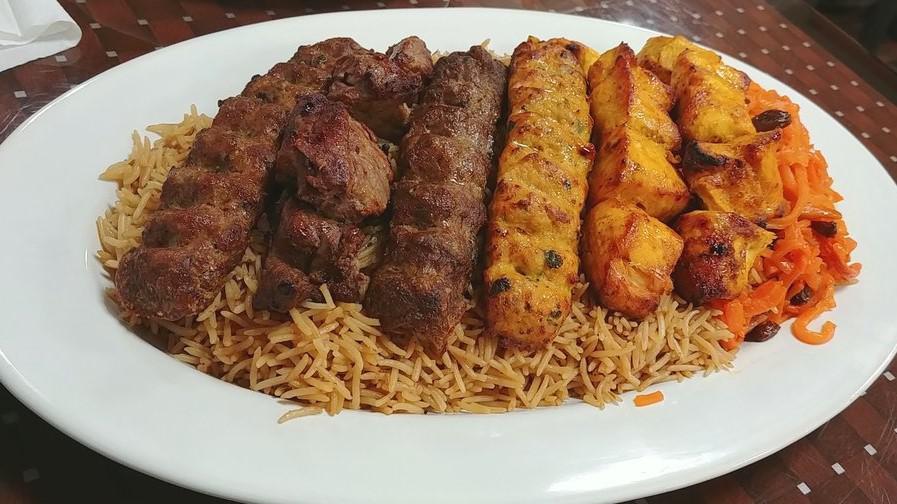 #18, Family Kabab Combo · Two chicken tikka, two beef kofta, one beef tikka, and one chicken kofta. Served with afghan rice, salad, and afghan naan. (rice topped with cooked carrots and raisins).