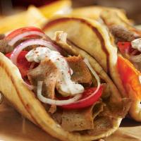 Lamb Gyro Combo · Includes Fries and FREE can soda. Gyro comes with Lettuce, Tomato, Onion & White Sauce.