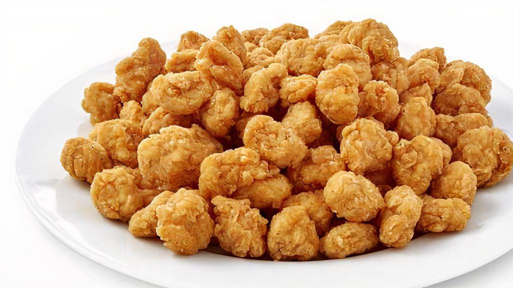 30 Pc Popcorn Chicken Combo · Small chicken in the shape of a popcorn. Includes french fries and a free can soda.