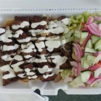 Lamb Over Rice & Salad · With rice and salad.