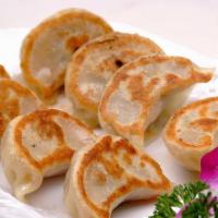 Pan-Fried Pork Dumpling 锅貼  · Northern Chinese style of dumpling that is steamed then pan-fried for a crispy wrapper with ...