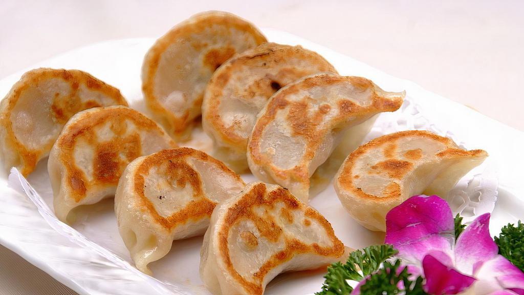 Pan-Fried Pork Dumpling 锅貼  · Northern Chinese style of dumpling that is steamed then pan-fried for a crispy wrapper with a pork and cabbage filling