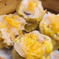 Steamed Pork Shumai 干蒸燒賣 · Steamed dumpling filled with pork, minced shrimp, and mushroom wrapped in a wonton wrapper a...