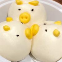 Steamed Piglet Bun  猪仔包  · Soft fluffy steamed white bun filled with sweetend egg custard, adorned with cute piglet decor
