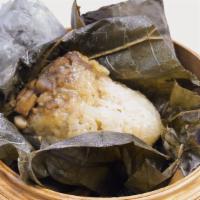Steamed Sticky Rice With Chicken In Lotus Leaf 珍珠雞 · Soft, chewy sticky rice mixed with bacon bits, chicken, chinese sausage steamed in lotus lea...