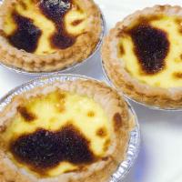 Portuguese Egg Tart 葡式蛋挞  · A Cantonese take on Pastéis de Nata is a crispy lard based puff pastry filled with a mound o...