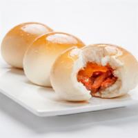 Baked Roasted Pork Bun 焗叉燒包 · Smooth lightly sugared golden-brown crusted bun filled with chinese barbeque roasted pork