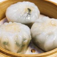 Steamed Green Leek Dumpling 韭菜餅 · Thin sticky layered dumpling wrapper that is steamed then pan-fried with freshly minced chiv...